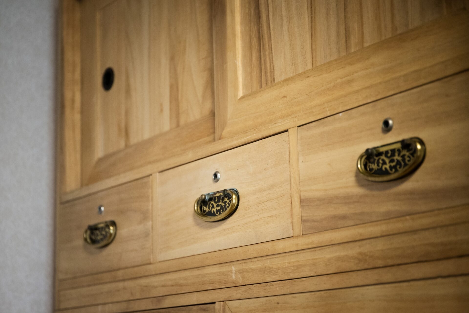 a wooden cabinet with drawers